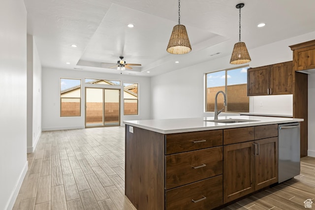 3594 W 185 N, Hurricane, UT 84737 - kitchen featuring dishwasher, a kitchen island with sink, sink, ceiling fan, and a tray ceiling