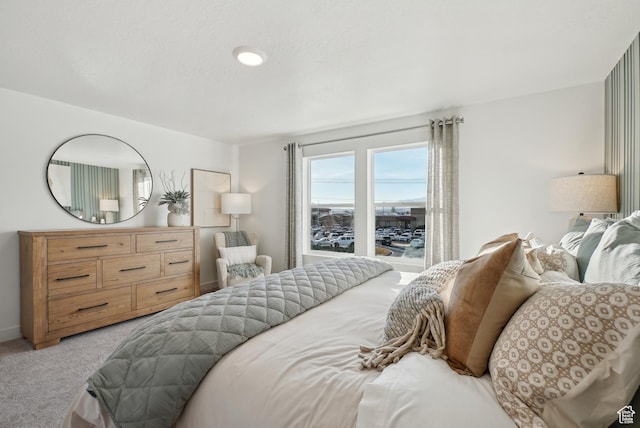 bedroom featuring light carpet
