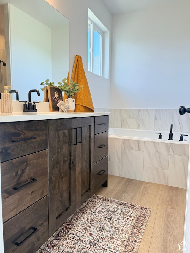 1520 E Parker Ln Unit 422, Lake Point, UT 84074 - full bath with wood finished floors, a garden tub, and vanity