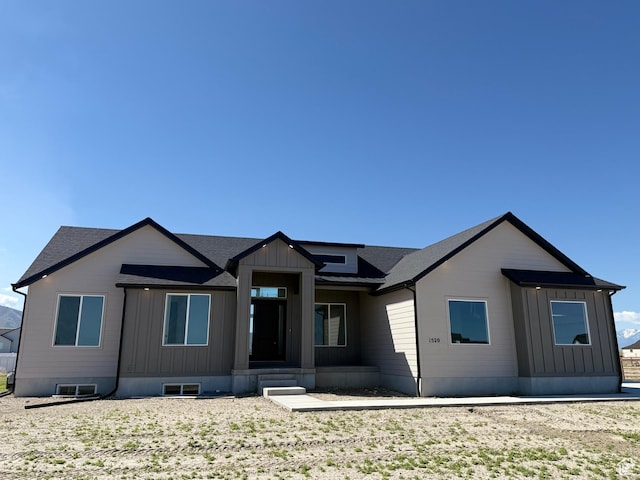 1520 E Parker Ln Unit 422, Lake Point, UT 84074 - view of front of house with a shingled roof and board and batten siding