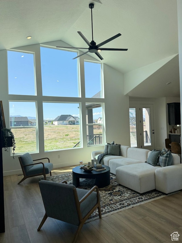 1520 E Parker Ln Unit 422, Lake Point, UT 84074 - living room featuring ceiling fan, a healthy amount of sunlight, high vaulted ceiling, and wood finished floors