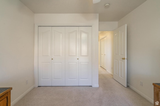 3423 Red Butte Dr, Santa Clara, UT 84765 - unfurnished bedroom with light carpet, baseboards, and a closet