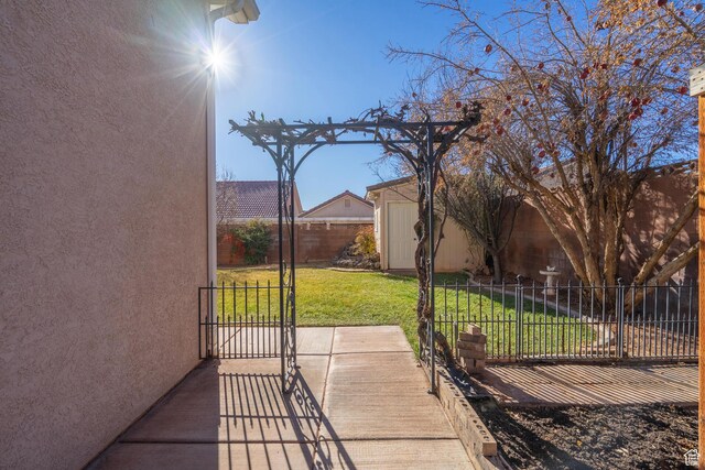 3423 Red Butte Dr, Santa Clara, UT 84765 - view of patio with a storage shed, an outdoor structure, and fence