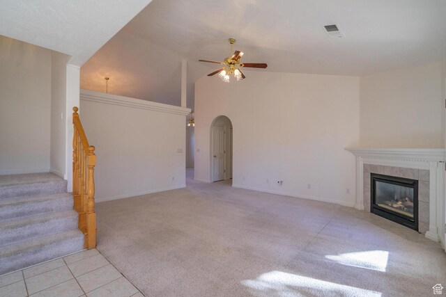 3423 Red Butte Dr, Santa Clara, UT 84765 - unfurnished living room featuring tile patterned flooring, visible vents, carpet floors, a fireplace, and a ceiling fan