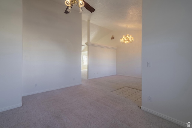 3423 Red Butte Dr, Santa Clara, UT 84765 - carpeted spare room with ceiling fan with notable chandelier, baseboards, and high vaulted ceiling