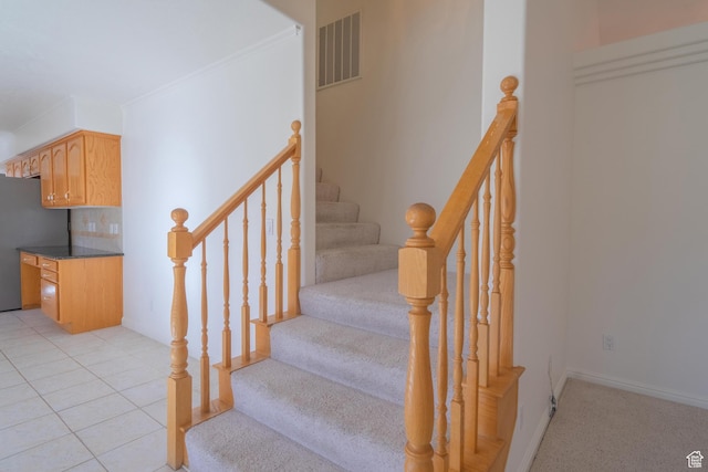 3423 Red Butte Dr, Santa Clara, UT 84765 - stairway featuring tile patterned flooring, baseboards, visible vents, and ornamental molding