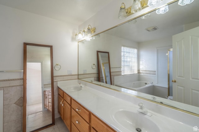 3423 Red Butte Dr, Santa Clara, UT 84765 - full bathroom featuring tile patterned floors, a bath, double vanity, and a sink