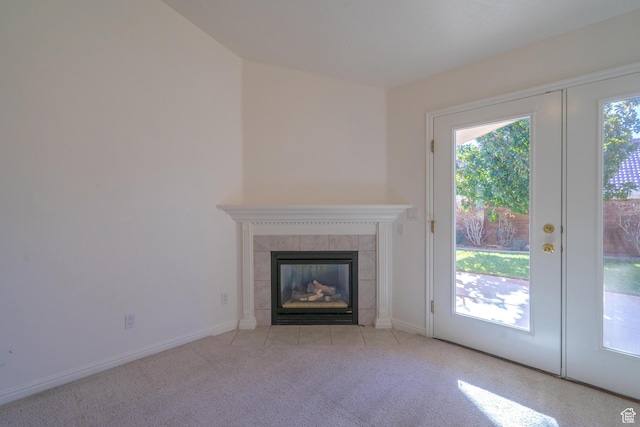 3423 Red Butte Dr, Santa Clara, UT 84765 - unfurnished living room featuring a healthy amount of sunlight, french doors, a fireplace, and carpet floors