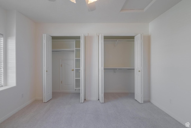 3423 Red Butte Dr, Santa Clara, UT 84765 - unfurnished bedroom with baseboards, attic access, ceiling fan, and carpet flooring