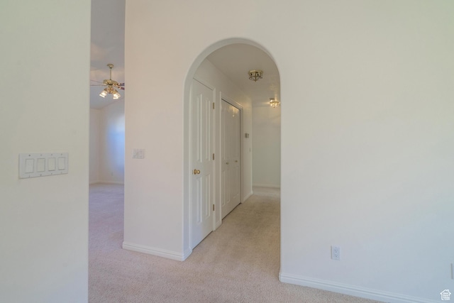 3423 Red Butte Dr, Santa Clara, UT 84765 - hall with baseboards, arched walkways, and carpet flooring