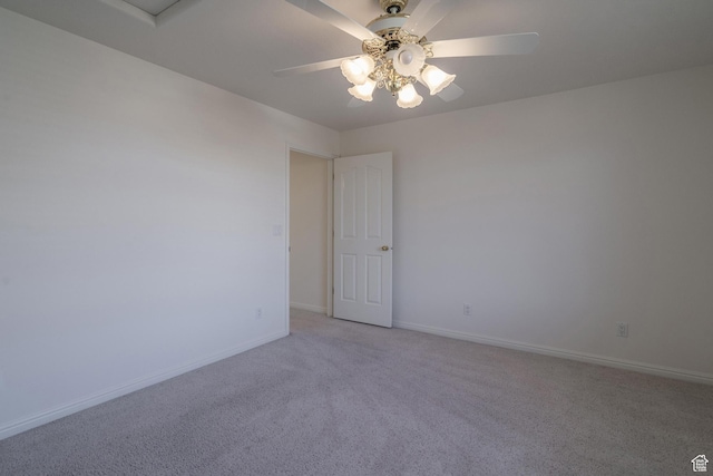 3423 Red Butte Dr, Santa Clara, UT 84765 - spare room featuring a ceiling fan, light colored carpet, and baseboards