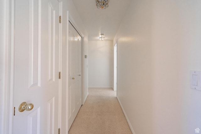 3423 Red Butte Dr, Santa Clara, UT 84765 - corridor featuring baseboards and light carpet