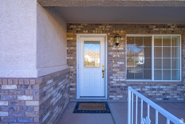3423 Red Butte Dr, Santa Clara, UT 84765 - doorway to property with stone siding and stucco siding