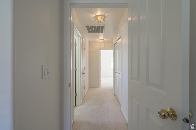 3423 Red Butte Dr, Santa Clara, UT 84765 - corridor featuring visible vents, light carpet, and baseboards