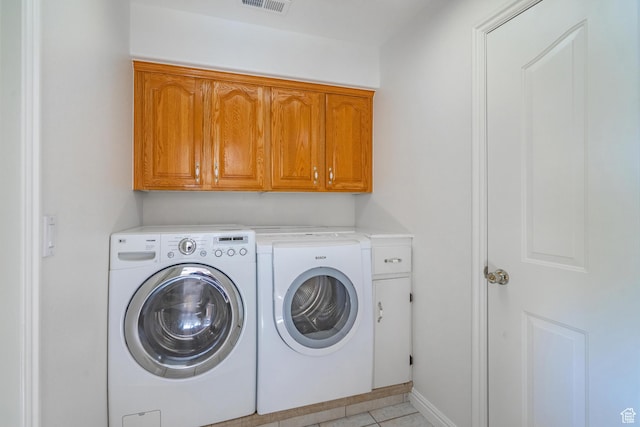 3423 Red Butte Dr, Santa Clara, UT 84765 - clothes washing area featuring visible vents, cabinet space, separate washer and dryer, light tile patterned flooring, and baseboards
