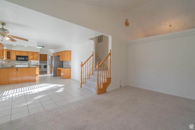 3423 Red Butte Dr, Santa Clara, UT 84765 - unfurnished living room featuring visible vents, light tile patterned floors, light colored carpet, washer / dryer, and ceiling fan