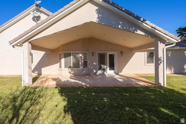 3423 Red Butte Dr, Santa Clara, UT 84765 - back of property with stucco siding, a patio, a lawn, and a tile roof