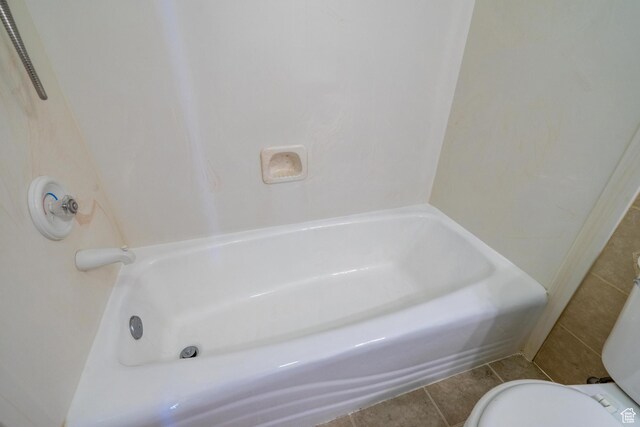 3423 Red Butte Dr, Santa Clara, UT 84765 - bathroom with tile patterned floors, a washtub, and toilet