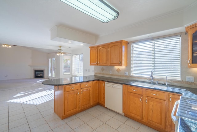 3423 Red Butte Dr, Santa Clara, UT 84765 - kitchen with range with electric cooktop, light tile patterned floors, white dishwasher, a glass covered fireplace, and a sink