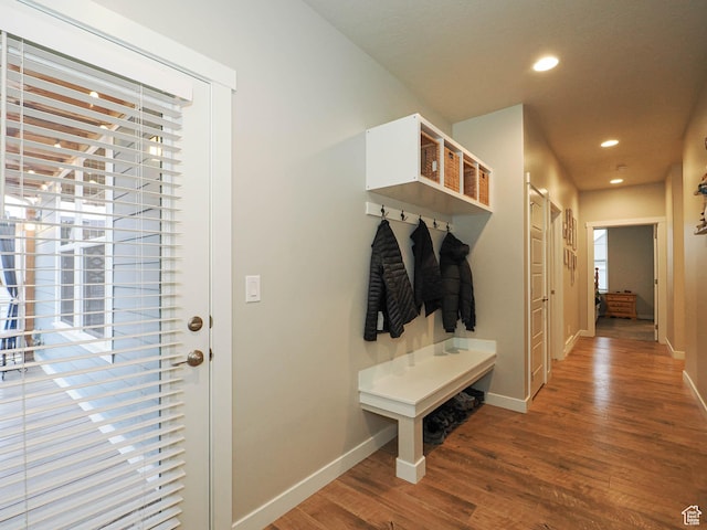 mudroom with recessed lighting, baseboards, and wood finished floors
