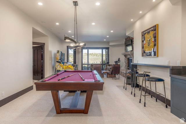 recreation room with a stone fireplace, recessed lighting, light carpet, baseboards, and billiards