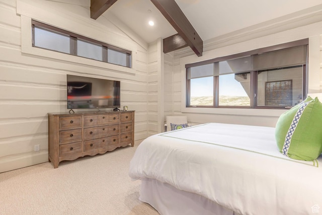 carpeted bedroom featuring lofted ceiling with beams