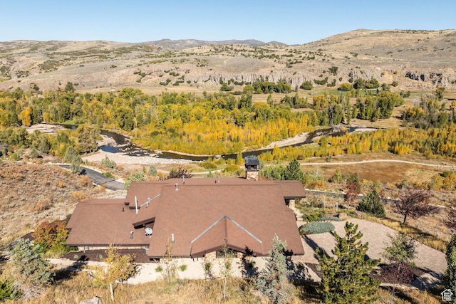 birds eye view of property with a mountain view