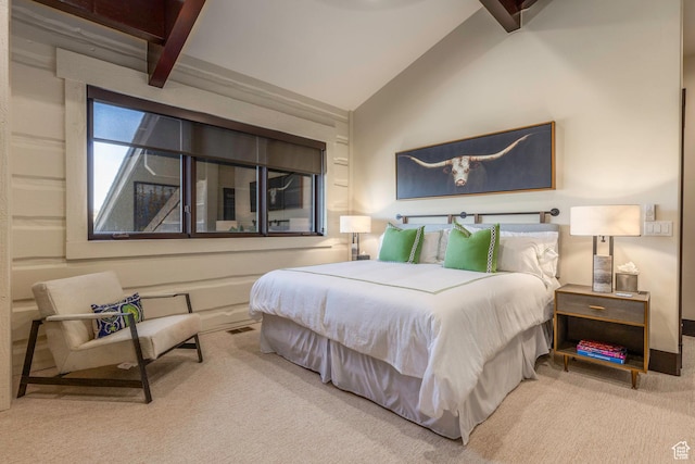 bedroom with vaulted ceiling and carpet floors