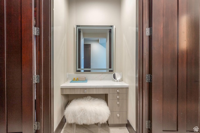 bathroom featuring baseboards and vanity