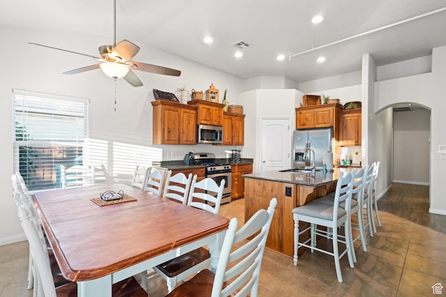 2468 S Dorothy St, Hurricane, UT 84737 - kitchen featuring ceiling fan, sink, a kitchen breakfast bar, an island with sink, and appliances with stainless steel finishes