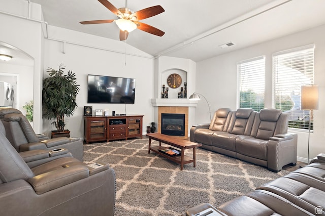 2468 S Dorothy St, Hurricane, UT 84737 - living room featuring ceiling fan, washer / dryer, lofted ceiling, and a tiled fireplace