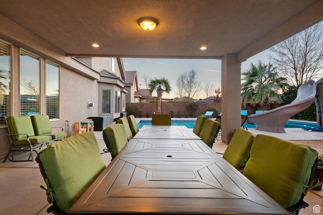 2468 S Dorothy St, Hurricane, UT 84737 - patio terrace at dusk with a fenced in pool