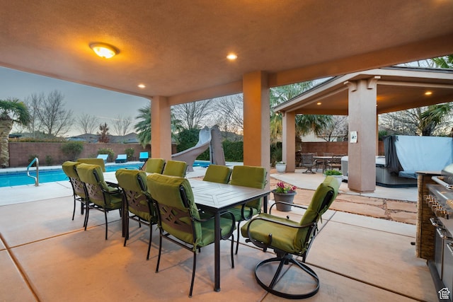 2468 S Dorothy St, Hurricane, UT 84737 - patio terrace at dusk featuring a fenced in pool
