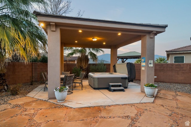 2468 S Dorothy St, Hurricane, UT 84737 - patio terrace at dusk with a gazebo and a hot tub