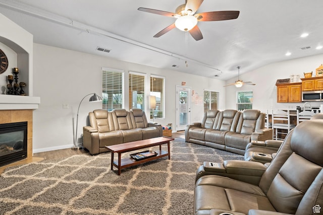 2468 S Dorothy St, Hurricane, UT 84737 - living room with lofted ceiling, track lighting, hardwood / wood-style flooring, ceiling fan, and a fireplace