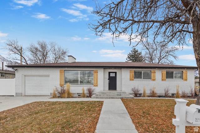 ranch-style house with a garage and a front yard