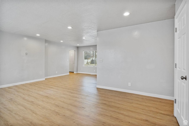 512 N 100 E, Orem, UT 84057 - spare room featuring light hardwood / wood-style floors and a textured ceiling