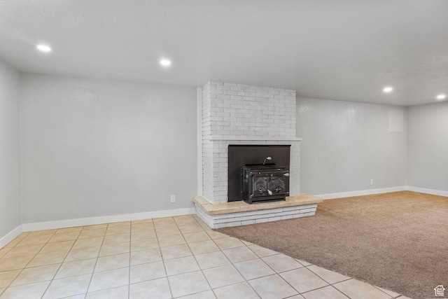 512 N 100 E, Orem, UT 84057 - unfurnished living room featuring a wood stove and light carpet