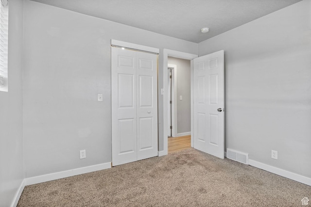 512 N 100 E, Orem, UT 84057 - unfurnished bedroom featuring carpet flooring and a closet