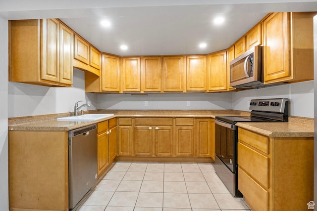 512 N 100 E, Orem, UT 84057 - kitchen with appliances with stainless steel finishes, light tile patterned floors, and sink