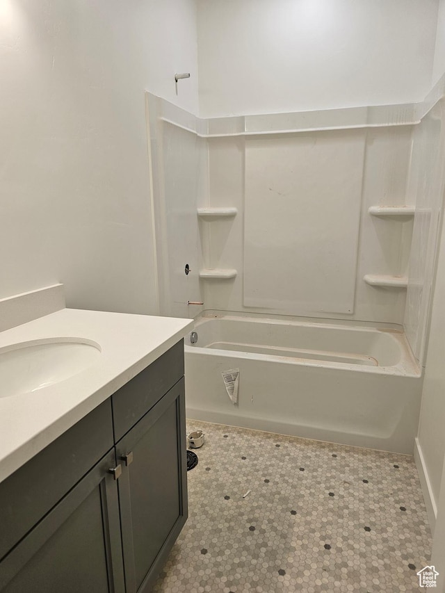 bathroom featuring bathtub / shower combination and vanity