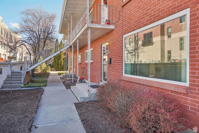 view of side of home with a balcony