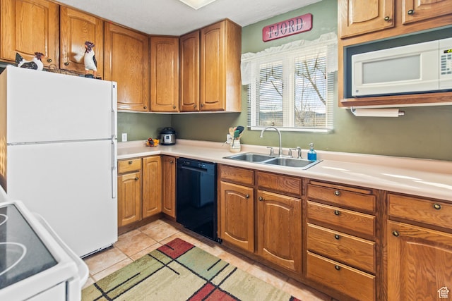 110 N 400 E, Glenwood, UT 84730 - kitchen with white appliances, a sink, light countertops, brown cabinetry, and light tile patterned floors