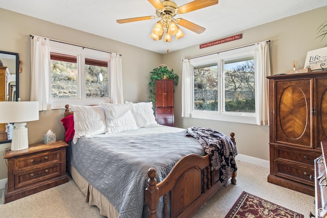 110 N 400 E, Glenwood, UT 84730 - bedroom featuring light carpet, multiple windows, baseboards, and ceiling fan