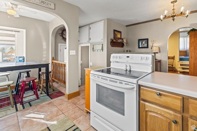 110 N 400 E, Glenwood, UT 84730 - kitchen featuring electric range, arched walkways, light countertops, and healthy amount of natural light