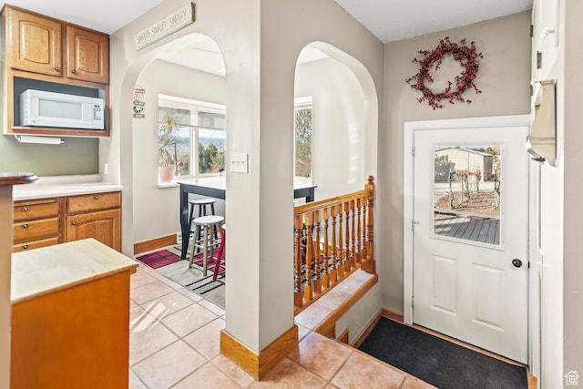 110 N 400 E, Glenwood, UT 84730 - foyer entrance with light tile patterned floors, arched walkways, and baseboards