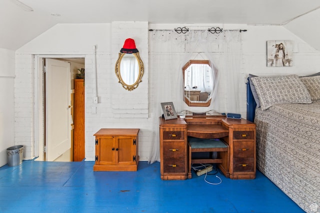 110 N 400 E, Glenwood, UT 84730 - bedroom featuring vaulted ceiling, brick wall, and concrete floors