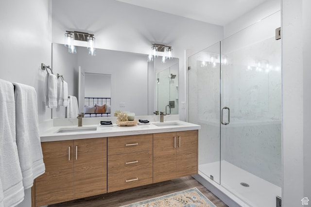 1618 S Main St Unit 3, Salt Lake City, UT 84115 - bathroom with wood-type flooring, a shower with door, and vanity