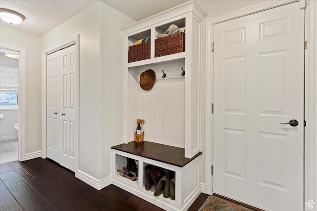 4147 N Wolf Ridge Cir, Eden, UT 84310 - mudroom featuring a textured ceiling and dark hardwood / wood-style flooring