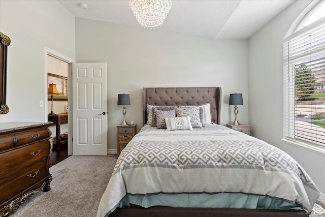 4147 N Wolf Ridge Cir, Eden, UT 84310 - carpeted bedroom with a chandelier and vaulted ceiling